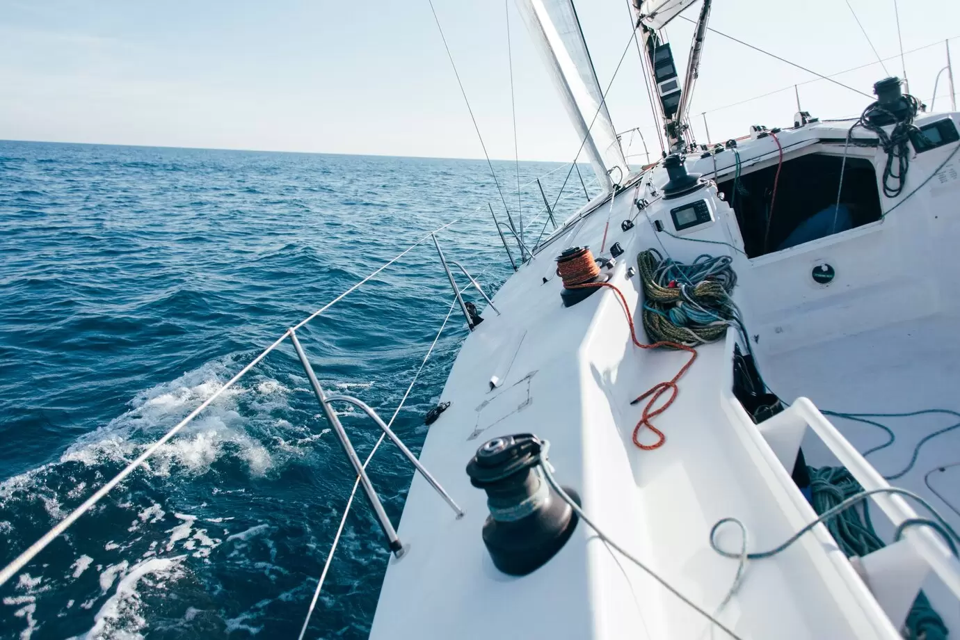 deck-professional-sailboat-racing-yacht-competition-sunny-windy-summer-day-moving-fast-through-waves-water-with-spinnaker-up_346278-333